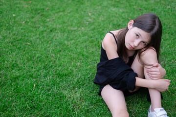 portrait of adorable teen brunette girl in black clothes outside. charming ukrainian child enjoying...