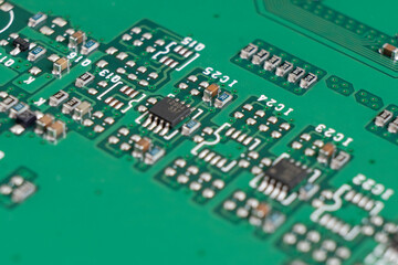 Macro shot of Circuit board with resistors microchips and electronic components. Computer hardware technology. Integrated communication processor. Information engineering. Semiconductor. PCB. Closeup