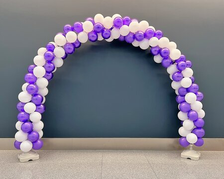 purple and white balloon arch