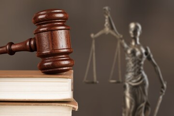 Law and judgment concept. Figure of Lady Justice with stack book.