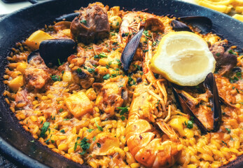 Paella served in paella pan.