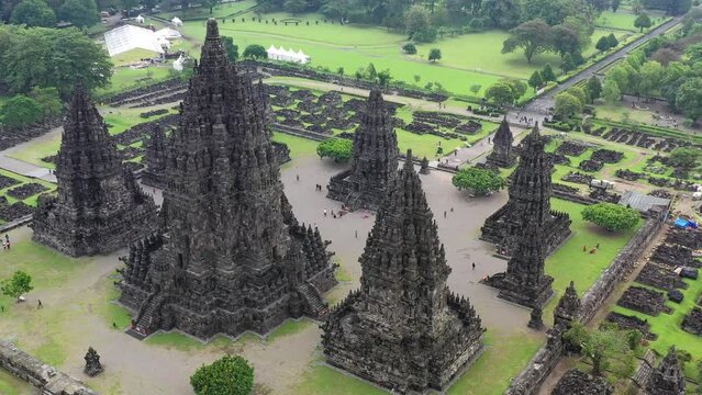 Hindu temple Prambanan in Yogyakarta, Indonesia during humid conditions, Aerial pedestal rising shot