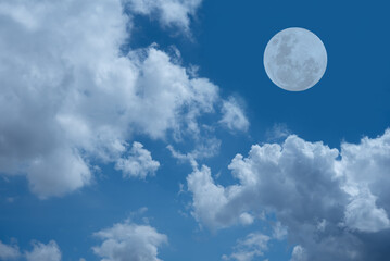 Fototapeta na wymiar Full moon on the blue sky with cloud.