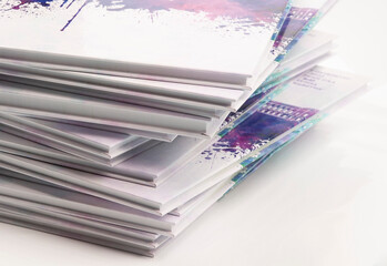 a stack of photo books and magazines