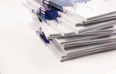 a stack of photo books and magazines