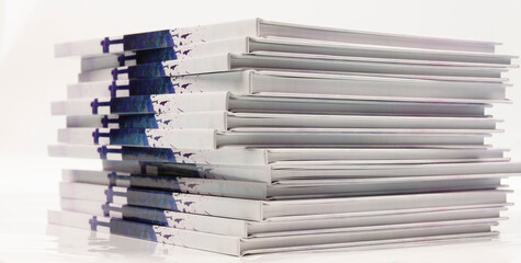 a stack of photo books and magazines