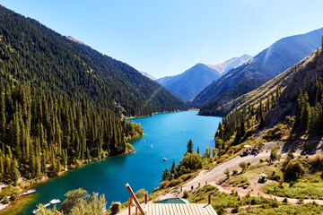 view of a mountain lake surrounded by forest