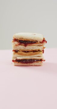 Vertical video of sandwich with jam and peanut butter