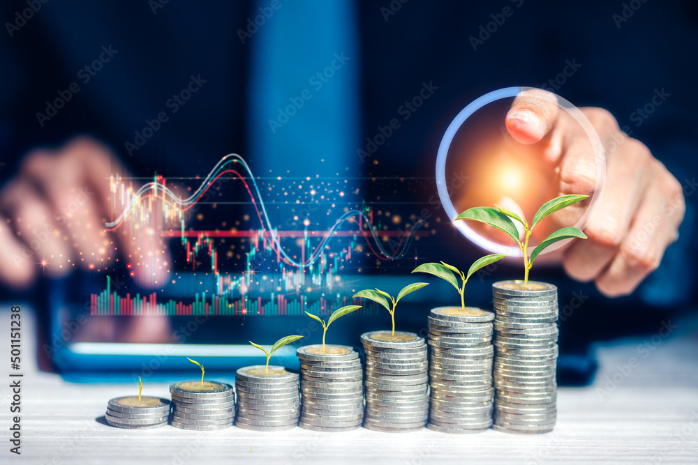 Poster businessman is touching virtual business graph and stacking coins with growing tree