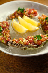 Beef tartar with salad and garlic toast on dark bread