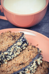 Zucchini dough and cup of white coffee. Delicious dessert