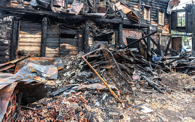 Charred ruins and remains of a burned down house