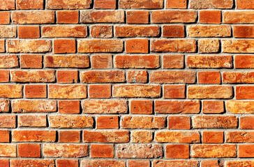 Old weathered red brick wall