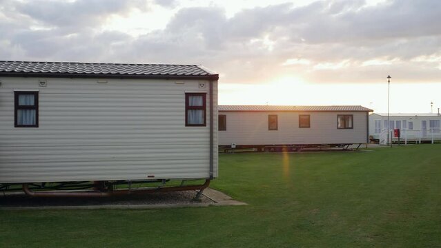 Modern holiday homes at a static caravan holiday park in the United Kingdom at sunset