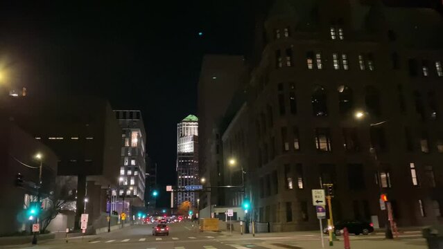 point of view of highway and cityscape from driver's angle in Minneapolis city at night