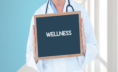Wellness - Doctor shows information on blackboard.Doctor holding chalkboard with text.