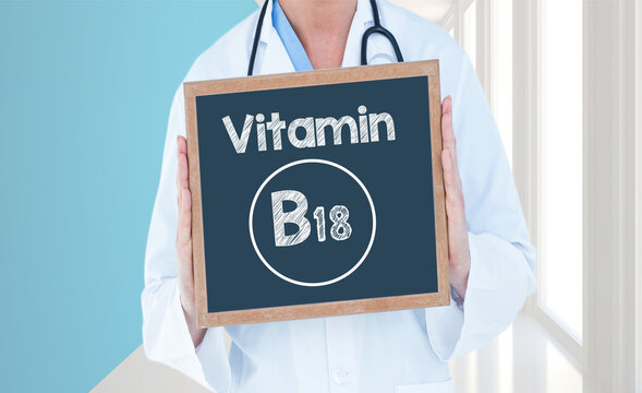 Vitamin B18 - Doctor shows information on blackboard.Doctor holding chalkboard with text.