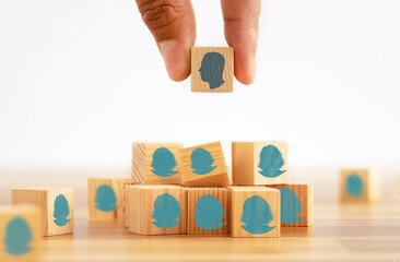 Close up photo of hand selecting male interviewee over female one on job application. Concept of...