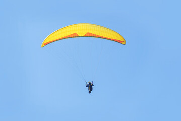 Paragliding on the background of the sky and mountains.