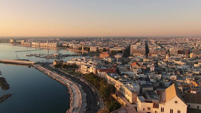bari aerial shot drone fly over city center seafront at sunrise,wide view of old port and waterfront 4k