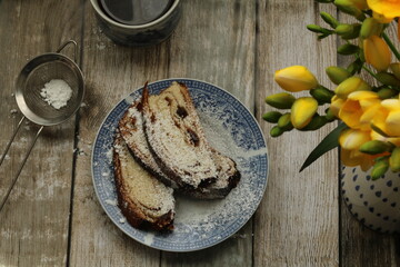 Yellow freesias and homemade slices cake. Romantic coffee time . Selective focus . Still life food stile 