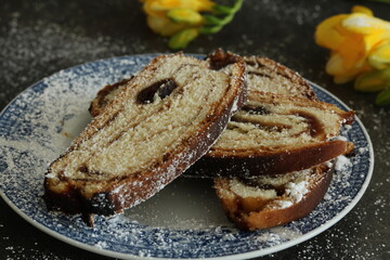Yellow freesias and homemade slices cake. Romantic coffee time . Selective focus . Still life food stile 