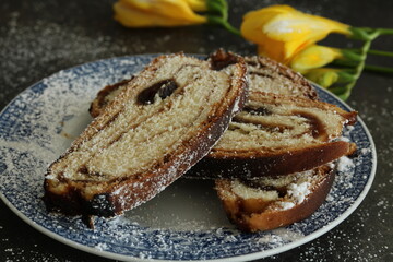 Yellow freesias and homemade slices cake. Romantic coffee time . Selective focus . Still life food stile 