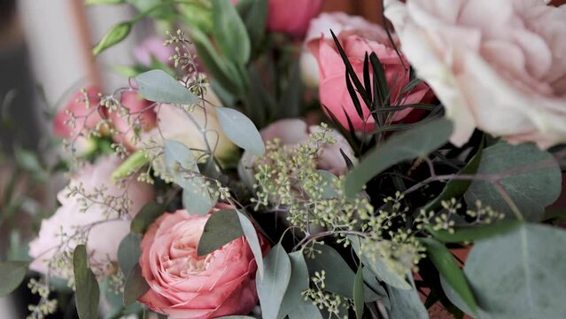 Close Up Wedding Flower Bouquet of Pink Florals and Greenery Outdoors 1080p 60fps