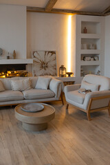 cozy warm home interior of a chic country house with an open plan, wood finishes, warm colors and a family hearth. view of the recreation area for family and guests