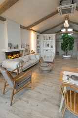 cozy warm home interior of a chic country house with an open plan, wood finishes, warm colors and a family hearth