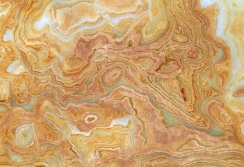 Slab marble onyx with brown, white and green colors. Texture. 