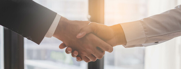 Successful asian young man, male partnership, teamwork handshake or greeting together at office...