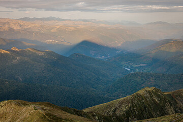 Fototapeta premium Shadow of the mountain in the morning