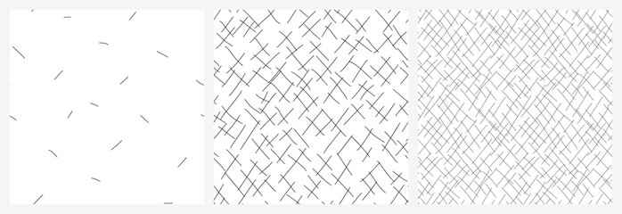 Neutral seamless pattern set with chaotic diagonal scribble lines. Black and white abstract scattered strokes vector design.