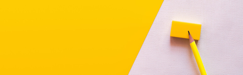 top view of pencil on eraser on white and yellow, banner. - obrazy, fototapety, plakaty