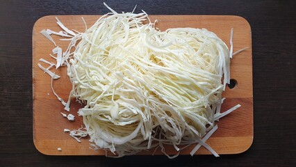 Shredded cabbage on a cutting board top view