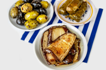Greek appetizer, sliced eggplant, olive and dolmades.