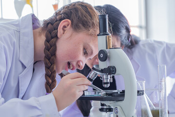 group children study science subjects and use Microscope