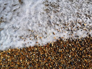 sea wave on pebble beach