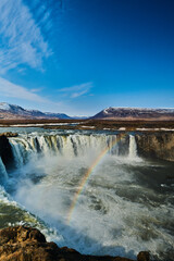 rainbow over  Icelandic Godafoss waterfall