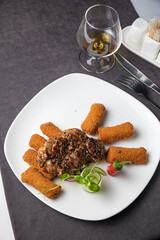 Meat dish in a restaurant on a set table
