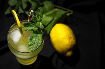 Fresh Lemonade or mojito cocktail with lemon, mint and ice