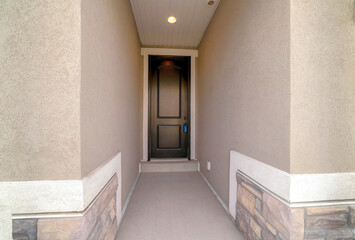 Entrance of a house with lockbox on the black front door