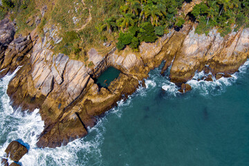 Guaruja. Natural swimming pool (Piscina Natural de Sorocotuba). Aerial view of sunny tropical...