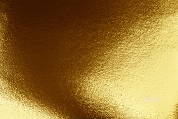 Texture of gold. Gold paper with dark and light shades.