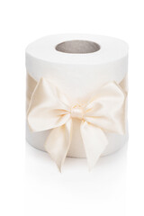 Toilet paper. A roll of white toilet paper tied with a beautiful light bow stands on a white isolated background. Funny gift concept. Present upon purchase