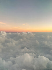 Early Morning  Sunrise and Cumulus Clouds from an Airplane Window