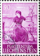 LICHTENSTEIN - CIRCA 1961: a postage stamp from LICHTENSTEIN , showing a Woman in Vineyard . Circa 1961