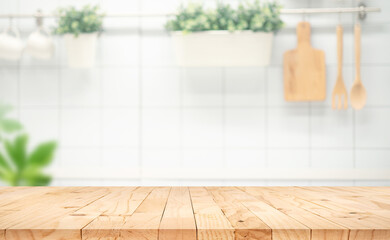 Selective focus.Wood table top on blur kitchen counter background.F