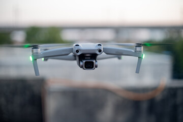 small grey folding zone with camera flying against a blurred background showing the rise of aerial photography